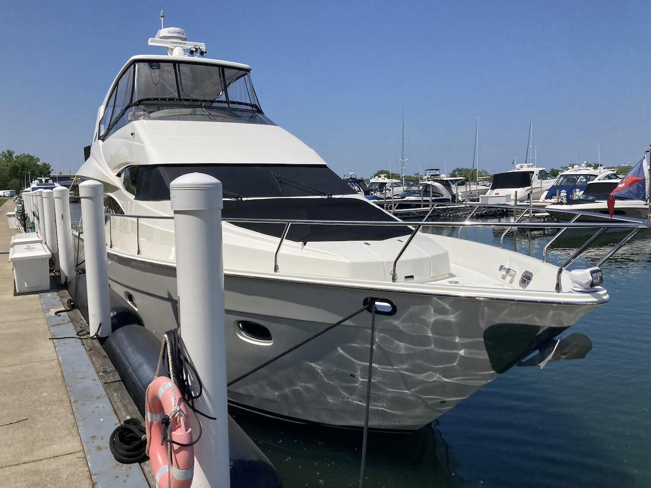 Boats for sale Cleveland marina with luxury yachts and recreational vessels docked on Lake Erie waterfront